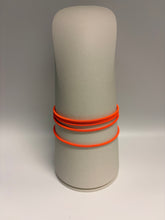 Load image into Gallery viewer, Gray cylindrical object with orange bands on a gray background