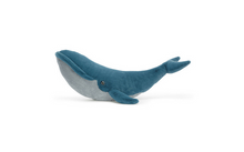 Load image into Gallery viewer, A blue and gray whale-shaped plush toy with a textured fabric body, photographed on a clean white background.