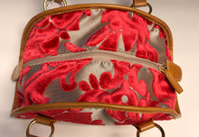Load image into Gallery viewer, Red floral patterned handbag with brown handles on a light background