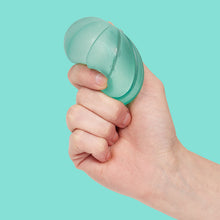 Load image into Gallery viewer, hand squeezing teal stress ball