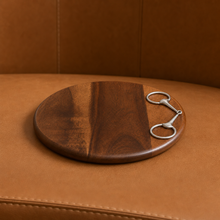 Load image into Gallery viewer, Vagabond House Cheese Board - Equestrian Bit with metal bit accent on a leather table