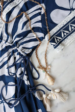 Load image into Gallery viewer, close up of the Cora Caftan showing shell accents on the drawstrings