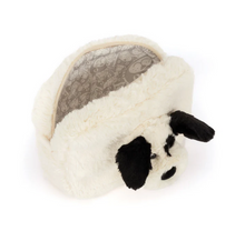 Load image into Gallery viewer, A plush dog-shaped cosmetic pouch or small pet bed in cream faux fur with black ears, black nose, and a patterned gray interior lining, shown on a white background.