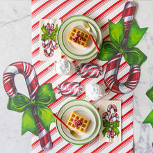 Load image into Gallery viewer, red and white diagonal striped paper table runner with other candy cane table accents