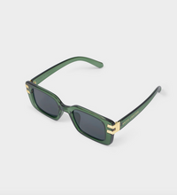 Load image into Gallery viewer, Polo Ralph Lauren sunglasses featuring a translucent dark green acetate frame, dark gray lenses, and gold metal accents on the temples, shown on a light gray background.