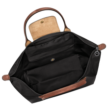 Load image into Gallery viewer, Longchamp Le Pliage Original L Top Handle Bag in black with brown leather handles and zipper open to show white interior