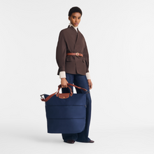 Load image into Gallery viewer, person holding Extended Le Pliage Original Extended Travel Bag in Navy