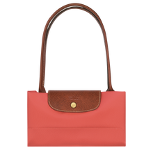 Load image into Gallery viewer, Longchamp Le Pliage Original Medium Shoulder Bag in a pink strawberry color folded and snapped closed