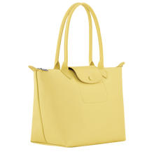Load image into Gallery viewer, yellow bag with matching yellow leather center flap and shoulder straps side view showing width