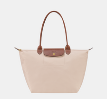 Load image into Gallery viewer, light tan canvas bag with leather strap and handles