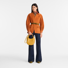 Load image into Gallery viewer, person holding a Longchamp Le Foulonné Leather Handbag - Small - Nutmeg
