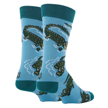 Load image into Gallery viewer, Blue and green socks with images of alligators