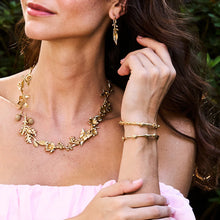 Load image into Gallery viewer, woman in gold jewelry with garden and meadow designs