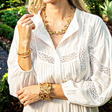 Load image into Gallery viewer, woman in gold jewelry with garden and meadow designs