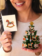 Load image into Gallery viewer, person holding a FreshCut Paper Mini Christmas Tree card and open card