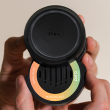 Load image into Gallery viewer, person putting a Beach Vacay Pura Car Diffuser Refill in a diffuser