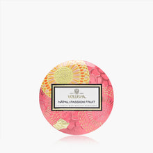 Load image into Gallery viewer, Voluspa Nāpali Passion Fruit Candle - Mini Tin 4oz showing label and pink and yellow floral pattern on container