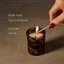 Load image into Gallery viewer, person lighting a candle Text reads Burn Time Up to 20 hours Ounces 2.0 oz