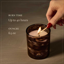 Load image into Gallery viewer, Person lighting a candle text reads Burn time up to 40 hours ounces 6.5 oz