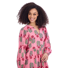 Load image into Gallery viewer, woman wearing long pink dress with long sleeves red and green print pattern