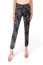 Load image into Gallery viewer, Navy pants with gold pattern worn by a person on a white background