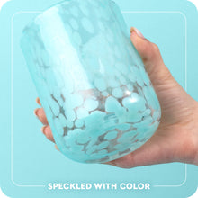 Load image into Gallery viewer, hand holding a glass cup graphic with text speckled with color