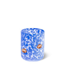 Load image into Gallery viewer, drinking glass is speckled royal blue with small football accents scattered across the glass