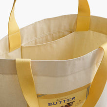 Load image into Gallery viewer, Rifle Paper East West Canvas Tote Bag - Butter open to show a small inner pocket below the handle