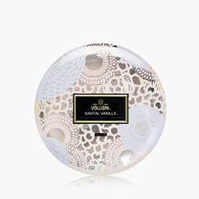 Load image into Gallery viewer, Voluspa Santal Vanille 3-Wick Tin Candle - 12oz top of lid with label