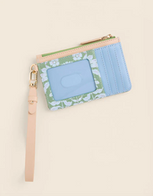 Load image into Gallery viewer, Blue floral wallet with a strap on a beige background