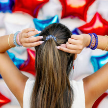 Load image into Gallery viewer, person wearing hair ties in their hair and on their wrists