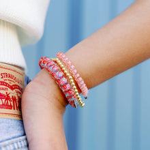 Load image into Gallery viewer, person wearing two sizes of teleties on their wrist