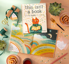 Load image into Gallery viewer, This Isn’t a Book (It’s My Thanks in Disguise) Book on a table