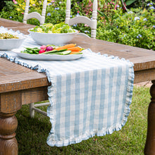 Load image into Gallery viewer, Juliska Gingham Ruffle 18" x 90" Table Runner on a wood table outside