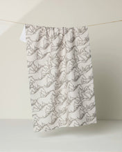Load image into Gallery viewer, tea towel with grey and cream images of many horses running