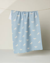 Load image into Gallery viewer, light blue towel with small images of white horses