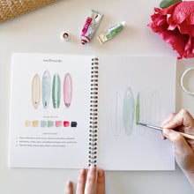 Load image into Gallery viewer, person painting surf boards in the Tropical Watercolor workbook