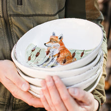 Load image into Gallery viewer, Vietri Wildlife Pasta Bowls being held in a stack