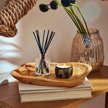 Load image into Gallery viewer, Voluspa Baltic Amber Reed Diffuser and candle set on a wood tray