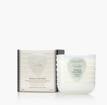 Load image into Gallery viewer, Voluspa Fonder Vanilla Voltage coconut wax candle in a ribbed frosted glass jar next to its cream-colored packaging box, set against a clean white background.