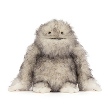 Load image into Gallery viewer, Plush toy resembling a creature with gray fur and white paws on a white background