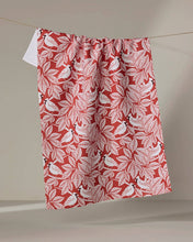 Load image into Gallery viewer, Geometry Cardinal Canopy Tea Towel handing from twine with a stack of clean dishes next to it