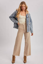 Load image into Gallery viewer, person wearing a Faux Fur Hooded Denim Jacket in a Light Wash