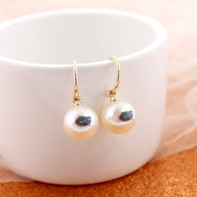 Load image into Gallery viewer, white pearl earrings with the gator head logo on gold half hoops