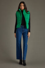 Load image into Gallery viewer, woman in a puffy Classic Green Vest paired with a black shirt and jeans with the vest open