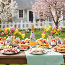 Load image into Gallery viewer, Champagne Bottle covered with the Springtime Serenade Champagne Bottle Wrap on a table set in a garden