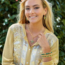 Load image into Gallery viewer, person wearing Capucine de Wulf Berry Gem Hinged gold and Malachite Bangle and matching earrings and necklace