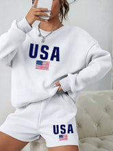 Load image into Gallery viewer, person in two-piece set featuring a white long sleeve crewneck sweatshirt and matching white shorts.