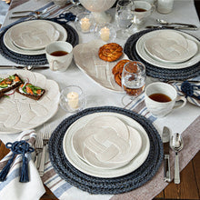 Load image into Gallery viewer, Juliska Mystic Knot Napkin Ring being used on a table with Celtic knot plates