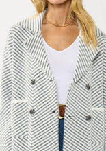 Load image into Gallery viewer, person wearing Black & WhiteChevron Stripe Button-Up Sweater Jacket close up of buttons and collar